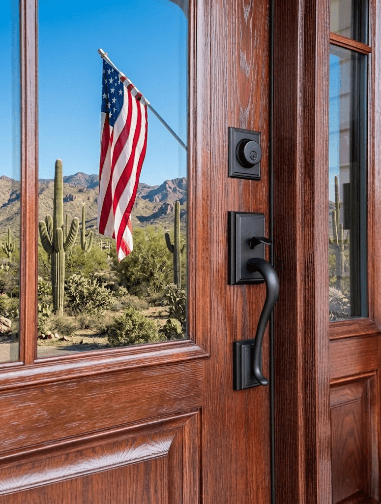 Picture of door window reflecting a American flag.